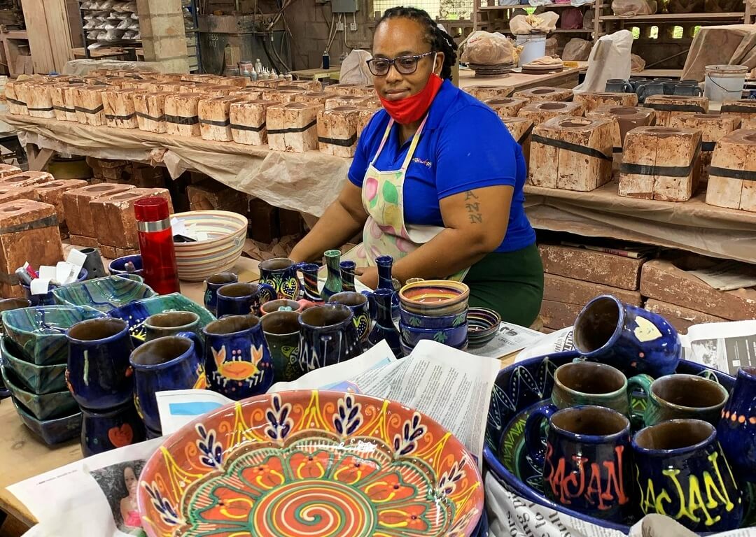 Potter overlooking ceramics