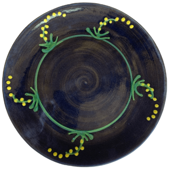 Round pottery pattern with blue background with yellow mimosa/cornflower design.