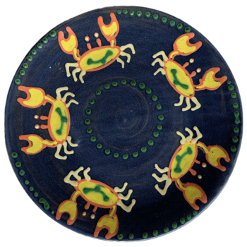 Pottery design with blue background with sand crabs dancing around the edges.