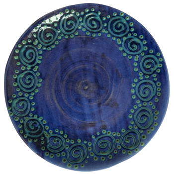 Pottery design with blue with small swirls surrounded by dots.