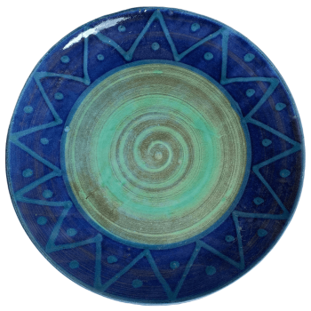 Round pottery design with green centre, turquoise sunburst on blue background.