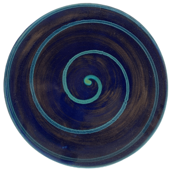 Round ceramic pottery design with blue background with green swirl.
