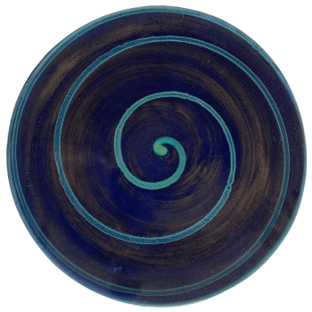 Round ceramic pottery design with blue background with green swirl.