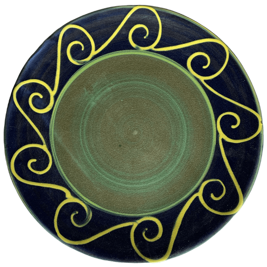 Ceramic pottery design with green centre, blue outer band with yellow waves.