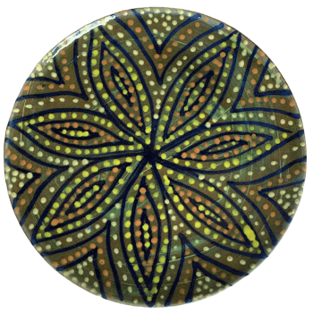 Pottery design with green background with a starburst of colorful crescents and dots.