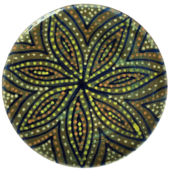 Pottery design with green background with a starburst of colorful crescents and dots.