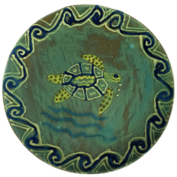 Ceramic pottery design featuring a green background with turtles