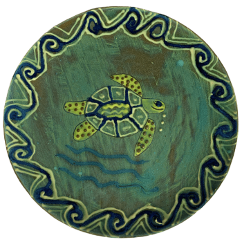 Ceramic pottery design featuring a green background with turtles