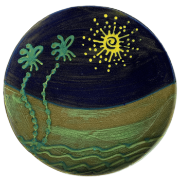 Round pottery design with spiky sun and palm tree pattern.