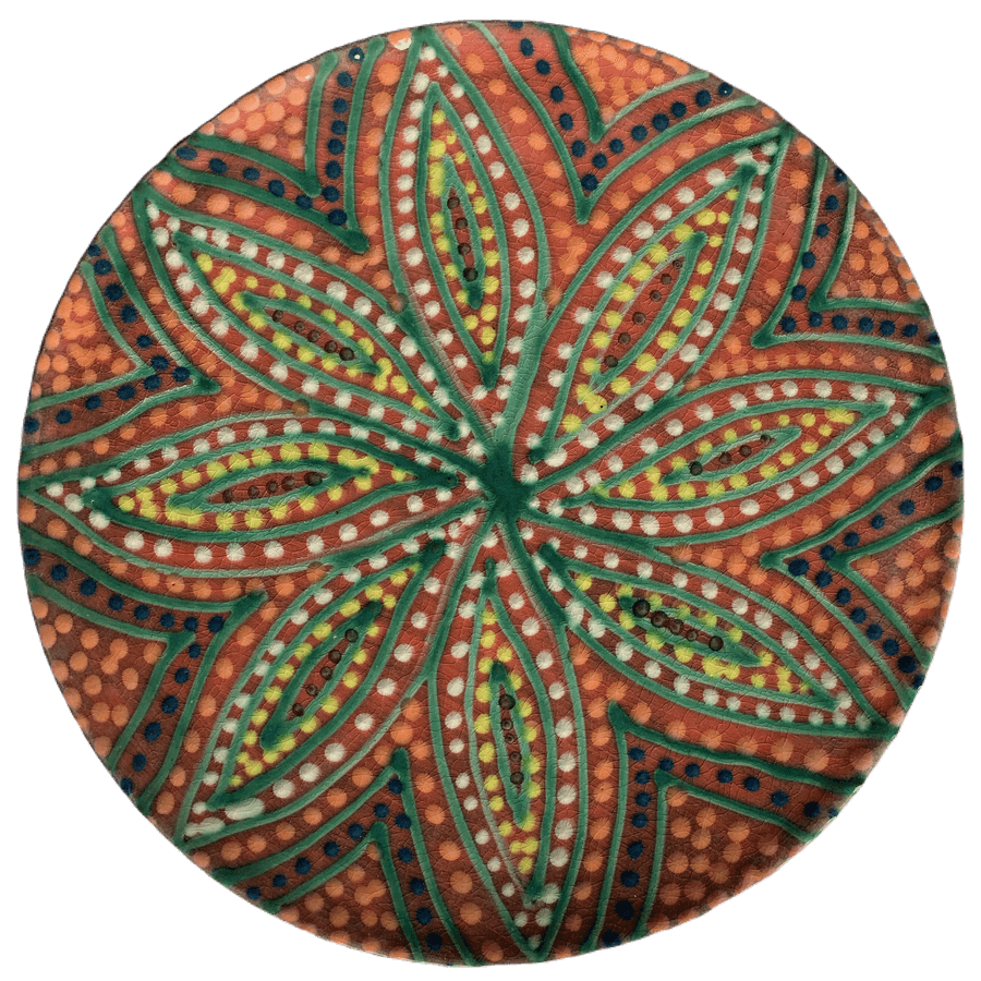 Pottery design with watermelon background with a starburst of colorful crescents and dots.