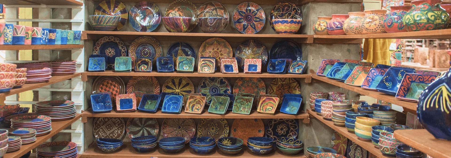 Wide array of ceramic pottery on the shelves at Earthworks Pottery in Barbados